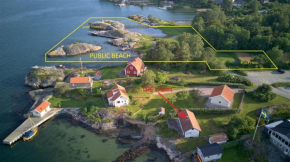 Holiday house with sea views and private beach on Tjorn in Höviksnäs